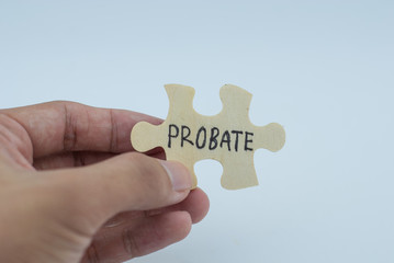 Unknown hand hold wooden puzzle with text probate