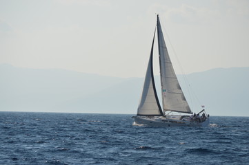 sailing yacht in the sea at sunset