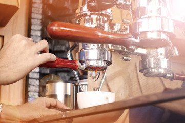 close up of coffee machine preparing cup of coffee