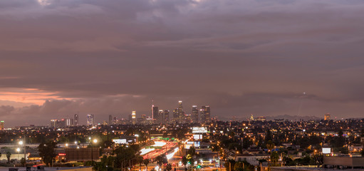 Obraz premium Sunset over Downtown Los Angeles and East LA on a stormy autumn evening, California, USA. 