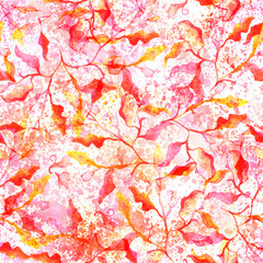 Seamless pattern with abstract red and yellow branches and leaves and a watercolour splashes texture