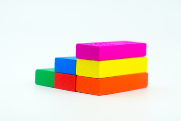 Arrangement of colorful wooden block on white background