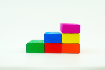 Arrangement of colorful wooden block on white background