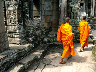 monks walking in a  temple at Angkor ,Cambodia