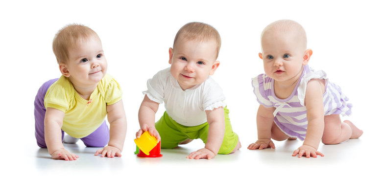 cute smiling babies weared clothes crawling isolated on white