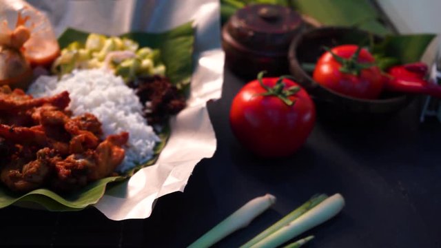 nasi kukus, traditional malay steamed rice with tumeric fried chickens