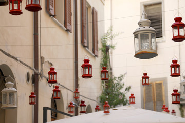 Fototapeta na wymiar Christmas lanterns hanging in street