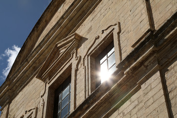 Fototapeta na wymiar Building with sunbeams reflection