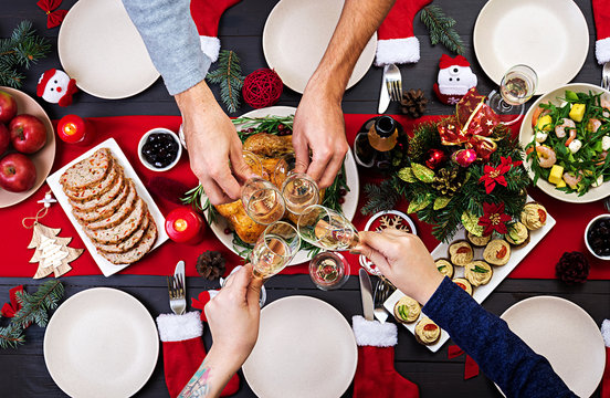 Baked Turkey. Christmas Dinner. The Christmas Table Is Served With A Turkey, Decorated With Bright Tinsel And Candles. Fried Chicken, Table.  Family Dinner. Top View