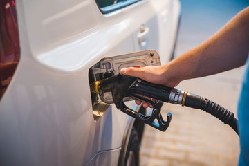 man fueling up the car