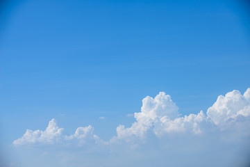 Rain clouds forming with blue sky background