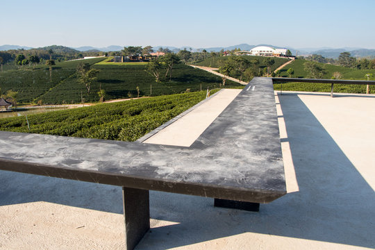 Perspective line image builded from black steel bench,dust dirty in viewpoint of attraction, Green tea field.