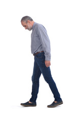 middle-aged man with blue jeans and shirt on white background