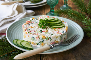 Salad with crab sticks, vegetables, rice and eggs