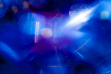 Fototapeta na wymiar Blurred spots of blue light