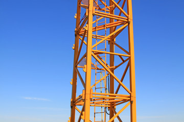 Fototapeta na wymiar tower crane base in the blue sky