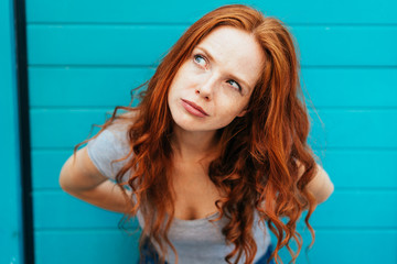 Thoughtful attractive redhead woman