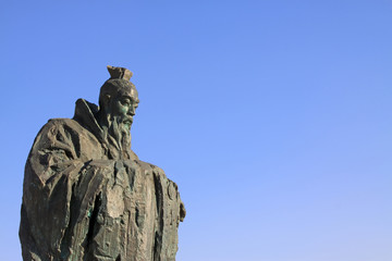 Figure sculpture in the blue sky in a park