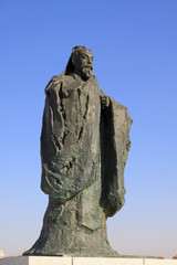 Fototapeta na wymiar Figure sculpture in the blue sky in a park