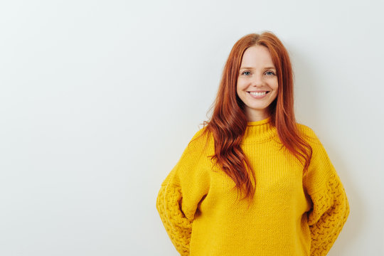 Happy smiling young redhead woman