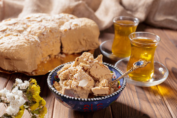 Tasty halva with tea on the table