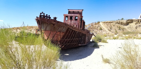 Boats cemetery around the Aral Sea. Rusty carcasses in the desert dunes where once there was water.