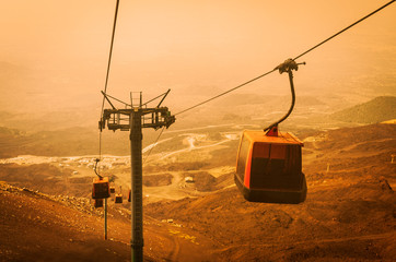 Elevators lift tourists to Mount Etna at sunrise, Catania, Sicily, Italy