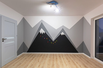 Kids bedroom with mountains chalkboard paint and new laminated floor