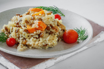 Rice with red lentils, vegetables and herbs, macro, vegan