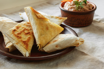 Pita bread with vegetable filling and sauce, fast food, vegan