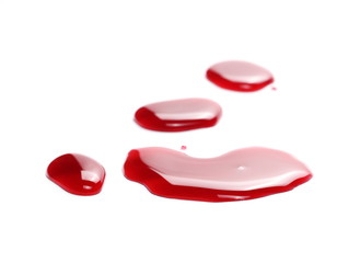 Red wine puddle, droplets isolated on white background