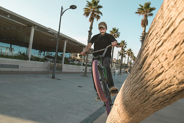 Bmx bike rider riding on the street