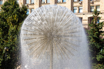 A fountain in the form of a ball with built-in tubes, from which water flows_