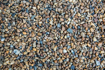 Sea pebbles. Small stones gravel texture background.Pile of pebbles, thailand.Color stone in background.