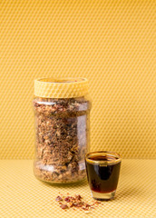 Propolis or bee glue is a resinous mixture that honey bees produce by mixing saliva and beeswax...