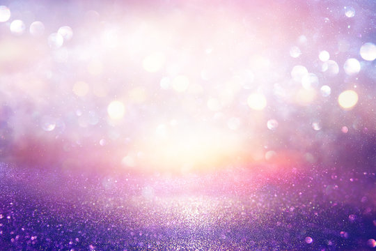 Glitter Vintage Lights Background. Silver, Purple And Light Gold De-focused.