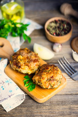 pork cutlets with greens on a wooden board