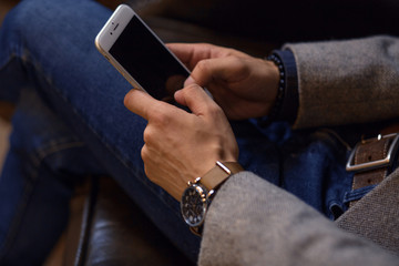 Smartphone top view. Man typing message of a smartphone