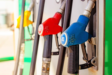 petrol filling gun close-up at the gas station