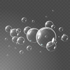 Realistic soap bubbles set isolated on the black transparent background. vector Illustration