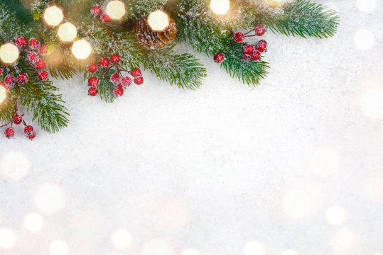 Christmas background design with decorated fir tree branch and snow