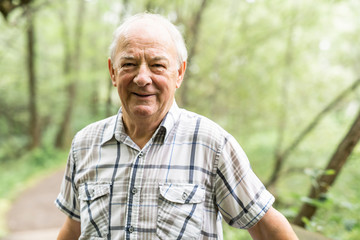 Senior man in the nice forest park
