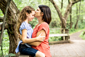 Fototapeta premium mother and her daughter on summer forest