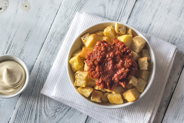 Portion of patatas bravas with sauces