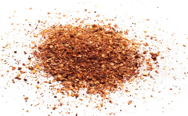 Crushed, ground red cayenne pepper, dried chili flakes and seeds isolated on white background