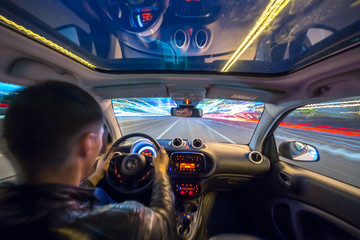 Night city road view from inside car