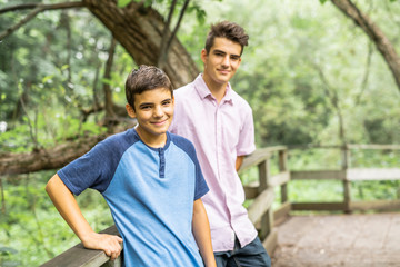 Two boys brother in forest on summer
