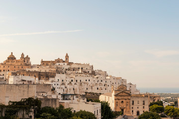 Obraz premium Panoramic view of the medieval white village of Ostuni at sunset