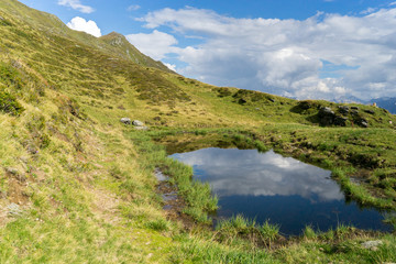 Fototapeta na wymiar Mountain lake landscape in Europe Tyrol Alps travel