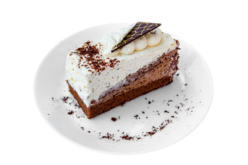 Double chocolate mousse cake slice with cacao on a plate and white background. Isolated.